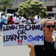 An environmental activist holds a sign as she takes part in the Climate strike protest calling for action on climate change, in Nairobi, Kenya, September 20, 2019.